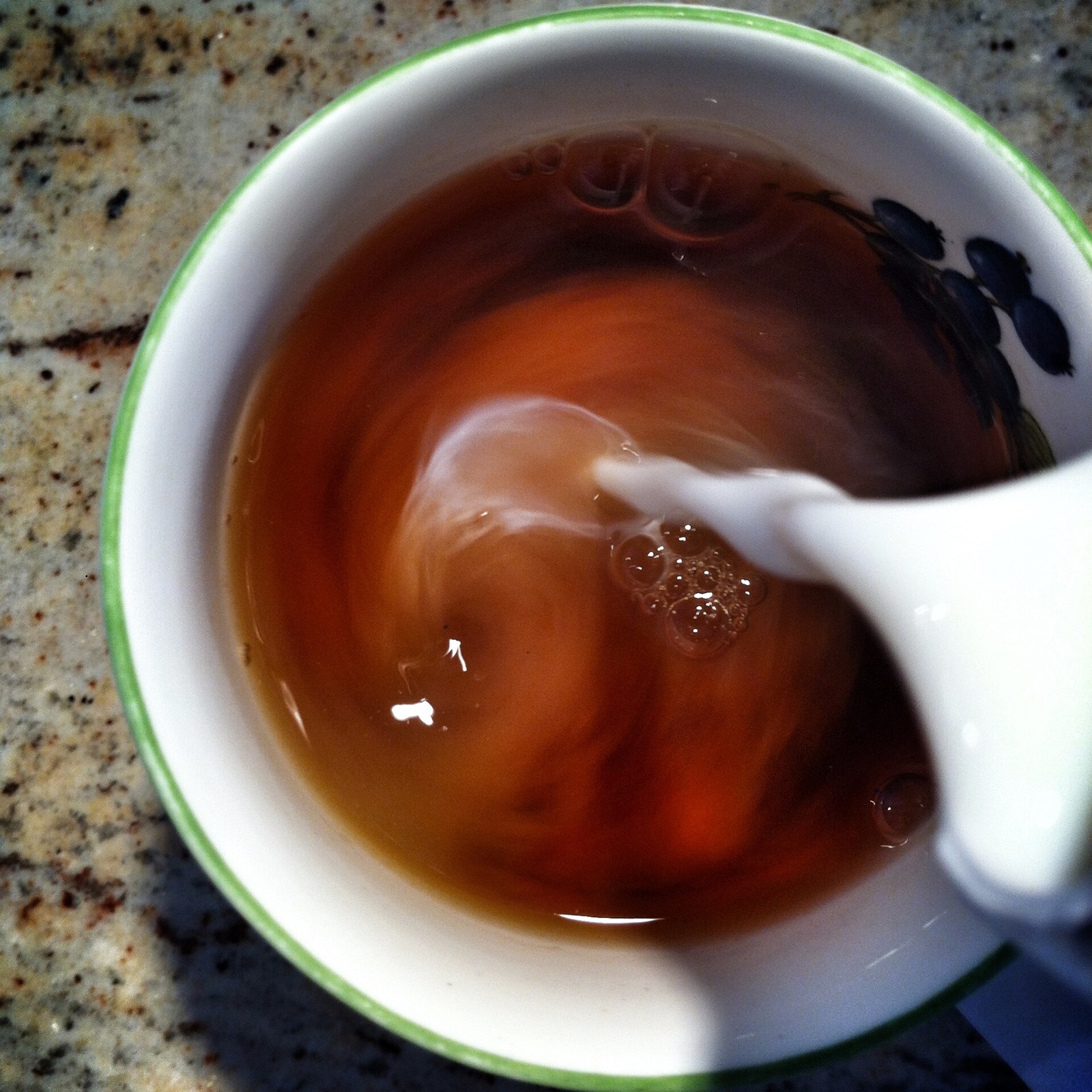 Milk being added to black tea for application evaluation